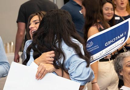 FAU Schmidt College of Medicine Match Day 2024 MD students celebrating and hugging after announcement